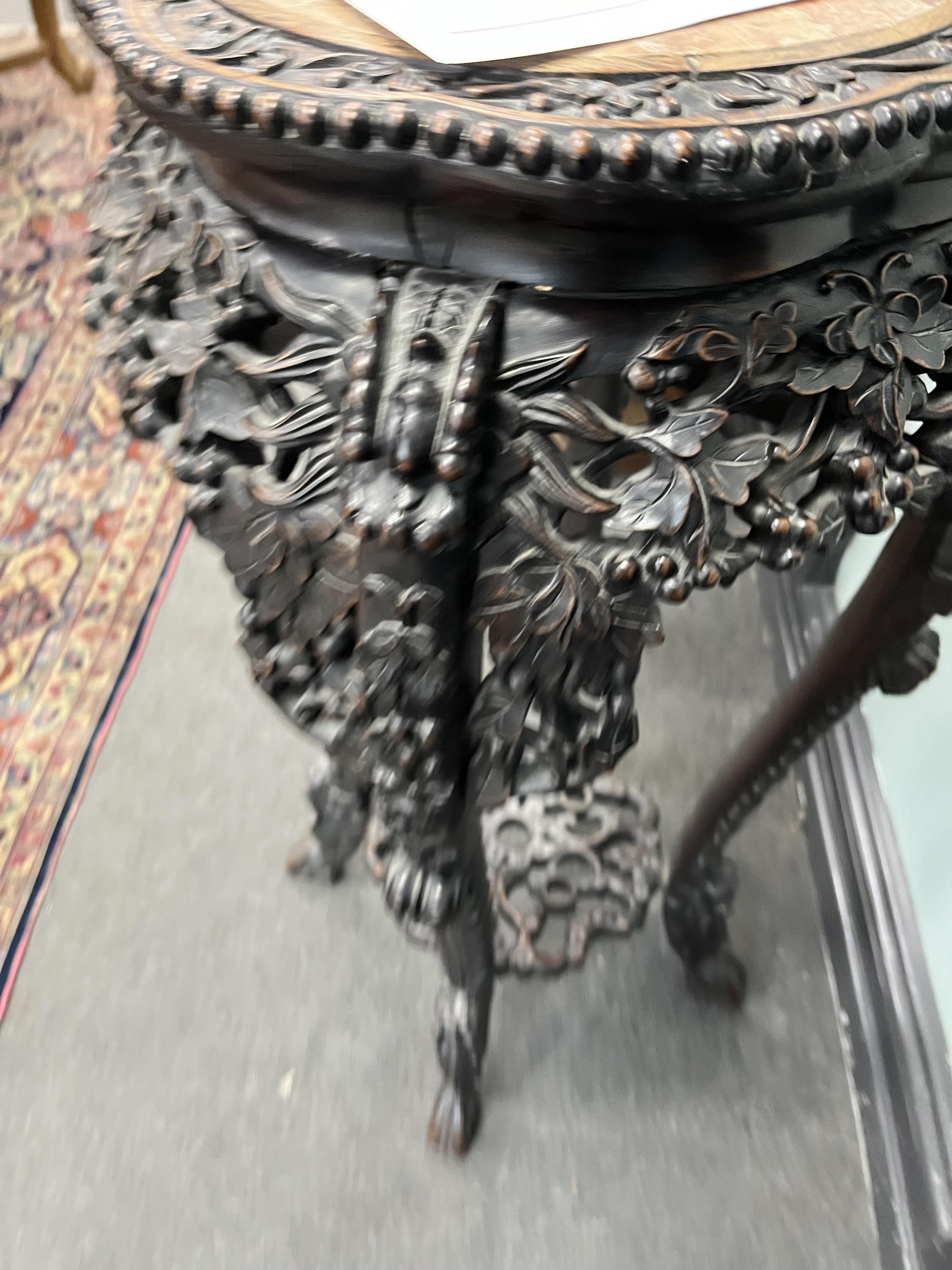 A Chinese carved hongmu rouge marble topped vase stand, diameter 42cm, height 93cm